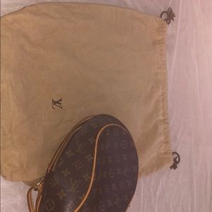 A Louis Vuitton bookbag  purse
